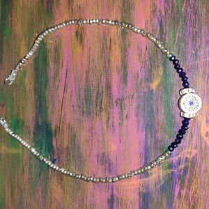 A choker made with evil eye Pandora bead.